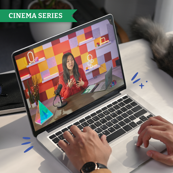 Person using a laptop with a video call on the screen, featuring a colorful background and a person in a red jacket. Time4Learning